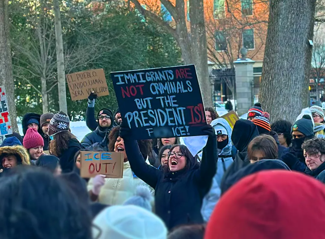 Photo: Emily Kim
Paloma Maya ’28 holds up a sign as she supports a protest organizer speaking during the SPIA protest.